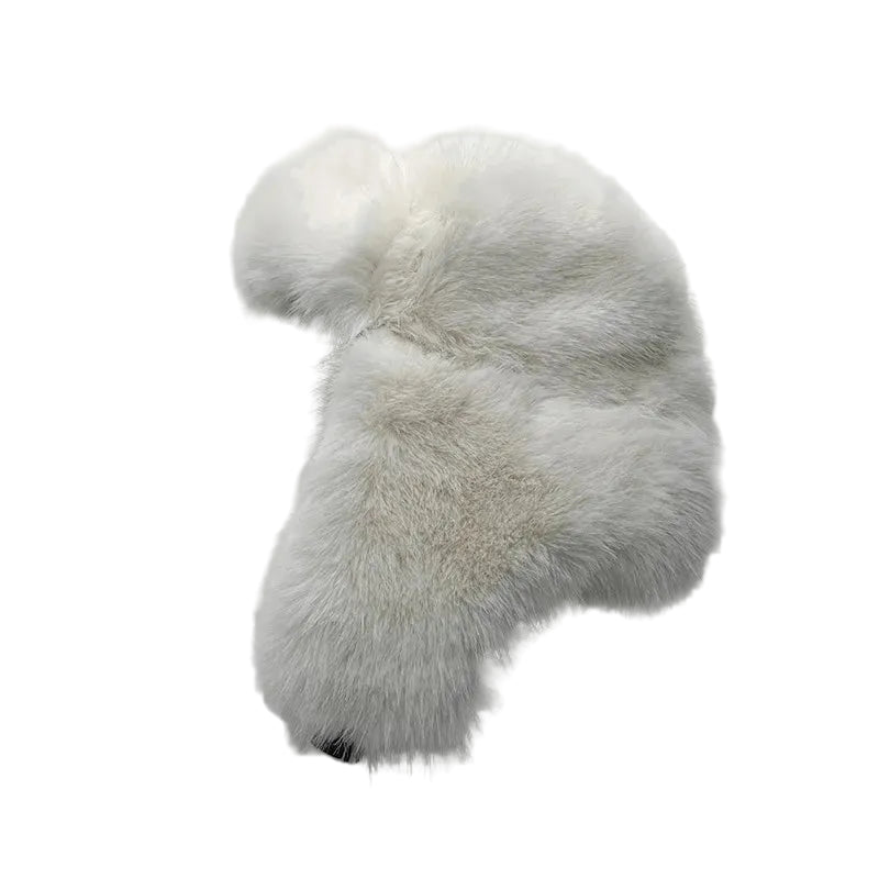 White fluffy slippers on a light gray background