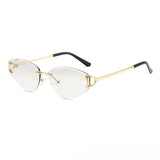 Gold-framed eyeglasses with black arms on a white background