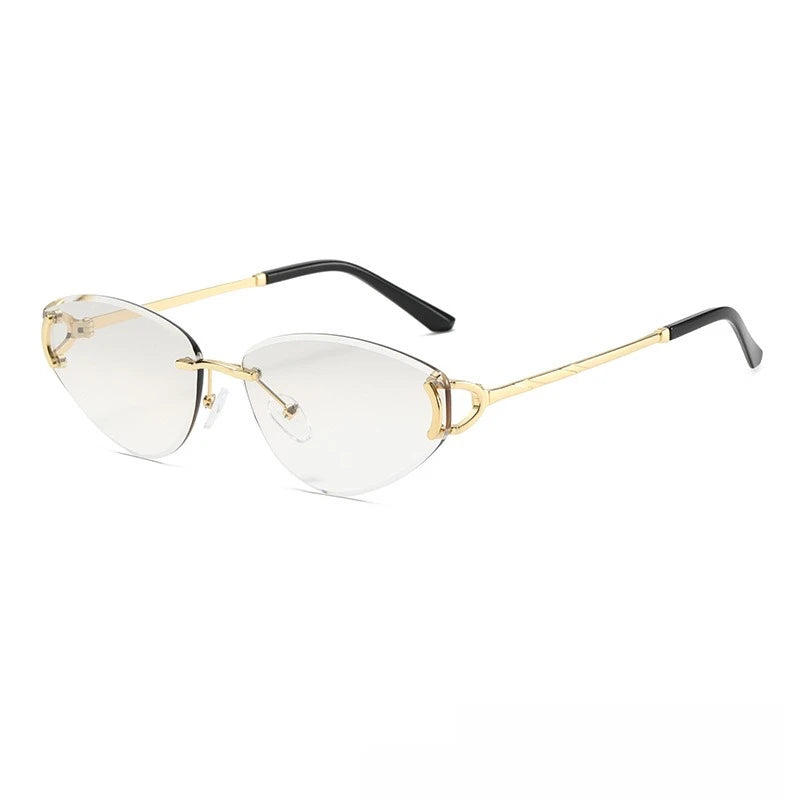 Gold-framed eyeglasses with black arms on a white background