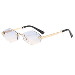 Sunglasses with gold frame and gradient lenses on a white background