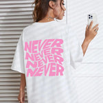 White Wavy letter print oversized graphic tee — lifestyle shot 4