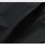 Close-up of a black fabric texture with a zipper