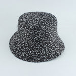 Black And White Bucket hat shown in angled view with allover leopard spot print