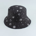 Black Bucket hat shown in angled view with celestial sun moon star print
