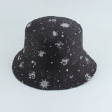 Black Bucket hat shown in angled view with celestial sun moon star print