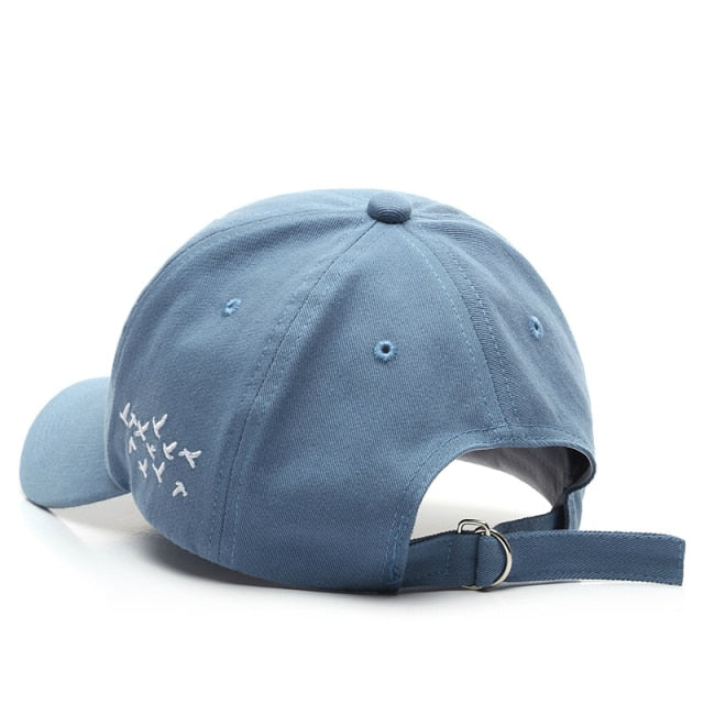 Blue Birds hat back view showing embroidered flock design and adjustable strap