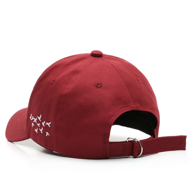 Burgundy Birds hat back view showing embroidered flock design and adjustable strap