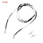 Color 17 Beaded glasses chain coiled showing mixed bead pattern with gold accents and clasp ends