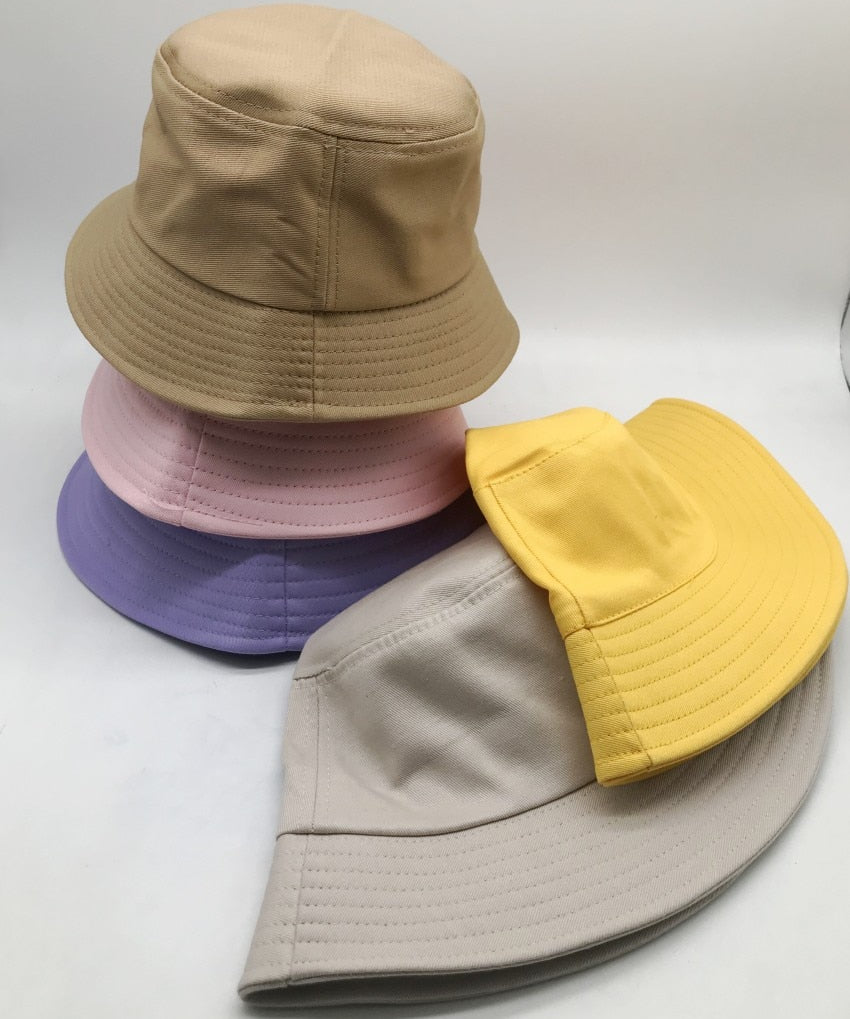 Kids bucket hat stack showing multiple colorways side by side