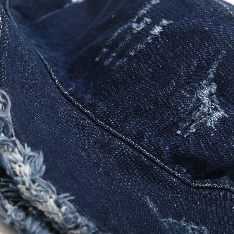 Navy Distressed denim bucket hat close-up of distressed scratch marks and frayed seam on crown