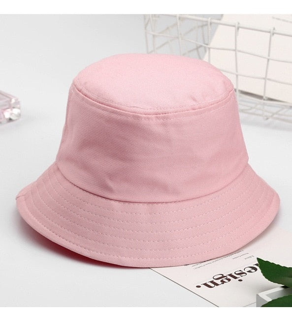 Pink Kids bucket hat angled view showing rounded crown and brim stitching