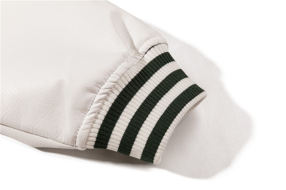 White Baseball jacket close-up of leather sleeve cuff with striped ribbing