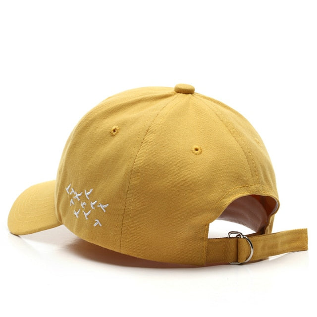Yellow Birds hat back view showing embroidered flock design and adjustable strap